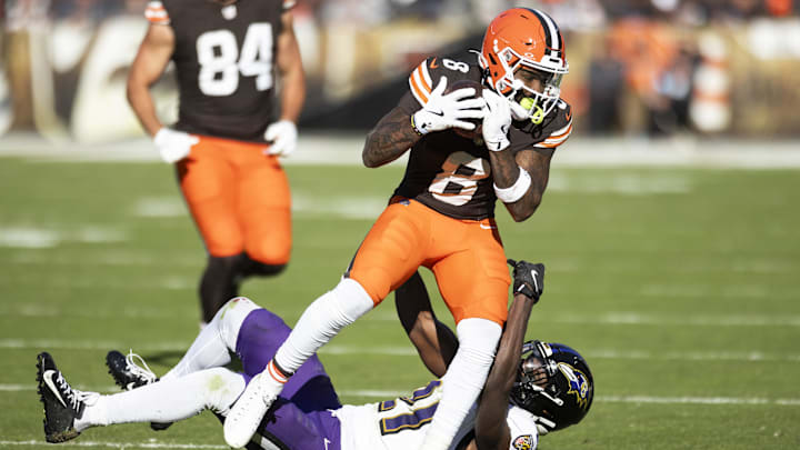 Oct 27, 2024; Cleveland, Ohio, USA; Cleveland Browns wide receiver Elijah Moore (8) makes a catch for a first down under coverage by Baltimore Ravens cornerback Brandon Stephens (21) during the fourth quarter at Huntington Bank Field. Mandatory Credit: Scott Galvin-Imagn Images