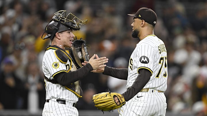 Sep 27, 2025; San Diego, California, USA; San Diego Padres relief pitcher Robert Suarez (75) and Freddy Fermin (54) celebrate after the Padres beat the Arizona Diamondbacks at Petco Park. Mandatory Credit: Denis Poroy-Imagn Images Sep 27, 2025; San Diego, California, USA; San Diego Padres relief pitcher Robert Suarez (75) and Freddy Fermin (54) celebrate after the Padres beat the Arizona Diamondbacks at Petco Park. Mandatory Credit: Denis Poroy-Imagn Images