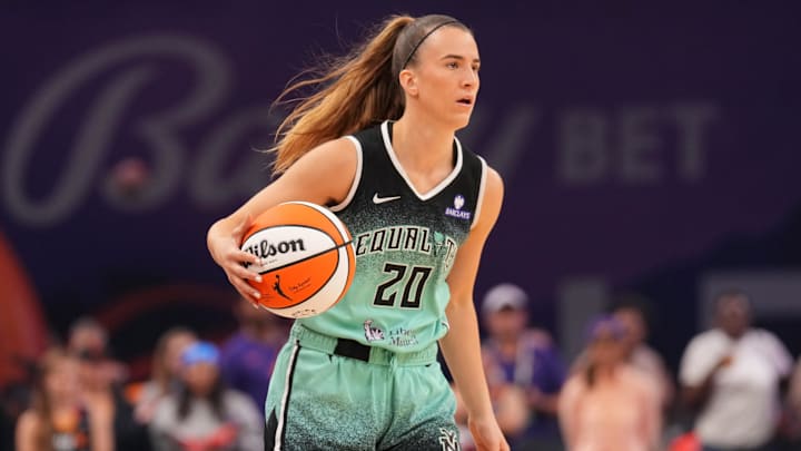 Sep 19, 2025; Phoenix, Arizona, USA; New York Liberty guard Sabrina Ionescu (20) dribbles against the Phoenix Mercury during the first half of game three of round one for the 2025 WNBA Playoffs at PHX Arena. Mandatory Credit: Joe Camporeale-Imagn Images