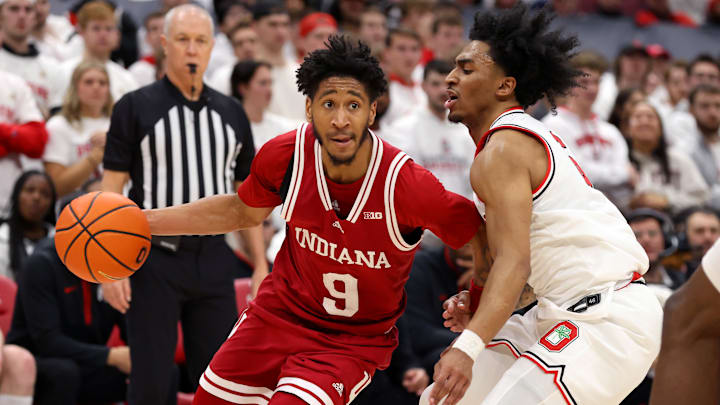 Jan 17, 2025; Columbus, Ohio, USA; Indiana Hoosiers guard Kanaan Carlyle (9) dribbles the ball as Ohio State Buckeyes guard Ques Glover (6) defends during the first half at Value City Arena. Mandatory Credit: Joseph Maiorana-Imagn Images