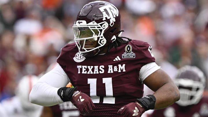 Dec 20, 2025; College Station, TX, USA; Texas A&M Aggies defensive tackle Tyler Onyedim (11) celebrates a sack during first half of the first round game of the CFP National Playoff against the Miami Hurricanes at Kyle Field. 