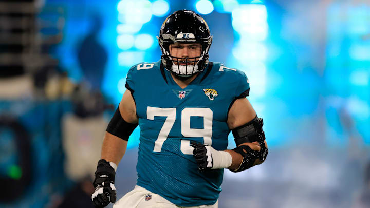 Jacksonville Jaguars center Luke Fortner (79) runs onto the field before an NFL first round playoff