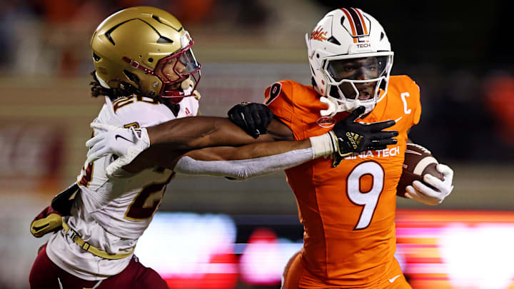 Oct 17, 2024; Blacksburg, Virginia, USA; Virginia Tech Hokies wide receiver Da'Quan Felton (9) runs the ball against Boston College Eagles defensive back KP Price (20) during the first quarter at Lane Stadium. Mandatory Credit: Peter Casey-Imagn Images