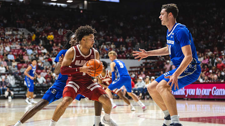 Dec 14, 2024; Tuscaloosa, Alabama, USA; Alabama Crimson Tide guard Mark Sears (1) faces pressure from Creighton Bluejays guard Jamiya Neal (5) and center Ryan Kalkbrenner (11) during the second half at Coleman Coliseum. Mandatory Credit: Will McLelland-Imagn Images