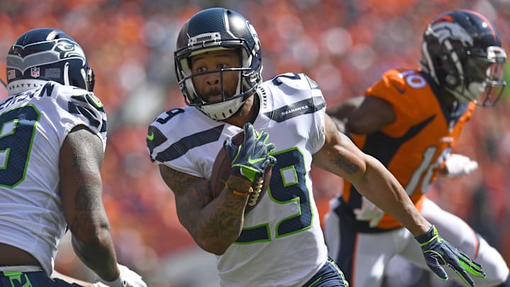 Sep 9, 2018; Denver, CO, USA; Seattle Seahawks free safety Earl Thomas (29) returns a interception in the first quarter at against the Denver Broncos Broncos Stadium at Mile High. Mandatory Credit: Ron Chenoy-Imagn Images