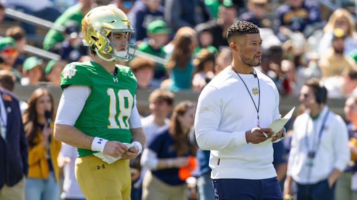 Apr 12, 2025; Notre Dame, IN, USA; Notre Dame Fighting Irish quarterback Steve Angeli (18) watches alongside head coach Marcus Freeman during the Blue-Gold game at Notre Dame Stadium. Mandatory Credit: Michael Caterina-Imagn Images