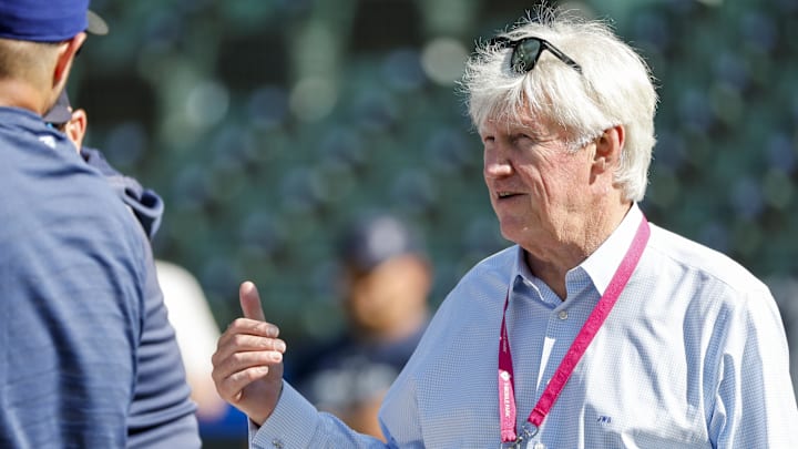 Seattle Mariners owner John Stanton talks with a player before a game against the Toronto Blue Jays on July 21, 2023, at T-Mobile Park.