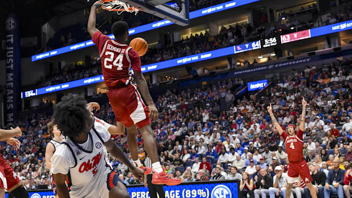 Mar 13, 2025; Nashville, TN, USA;  Arkansas Razorbacks forward Trevon Brazile (4) reacts after the dunk of forward Billy Richmond III (24) against the Mississippi Rebels during the second half at Bridgestone Arena. Mandatory Credit: Steve Roberts-Imagn Images
