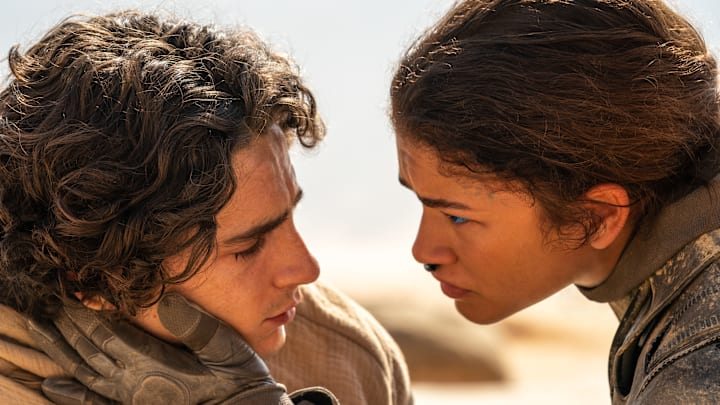 (L-r) TIMOTHÉE CHALAMET as Paul Atreides and ZENDAYA as Chani in Warner Bros. Pictures and Legendary Pictures’ action adventure “DUNE: PART TWO,” a Warner Bros. Pictures release. Photo Credit: Niko Tavernise © 2023 Warner Bros. Entertainment Inc. All Rights Reserved.