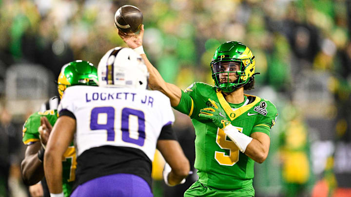 Dec 20, 2025; Eugene, OR, USA; Oregon Ducks quarterback Dante Moore (5) throws a pass during the third quarter against the James Madison Dukes at Autzen Stadium. Mandatory Credit: Troy Wayrynen-Imagn Images