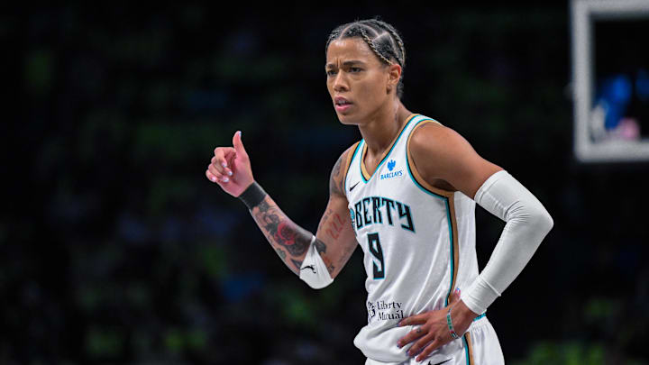 Jul 26, 2025; Brooklyn, New York, USA; New York Liberty guard Natasha Cloud (9) reacts during the first half against the Los Angeles Sparks at Barclays Center. Mandatory Credit: John Jones-Imagn Images