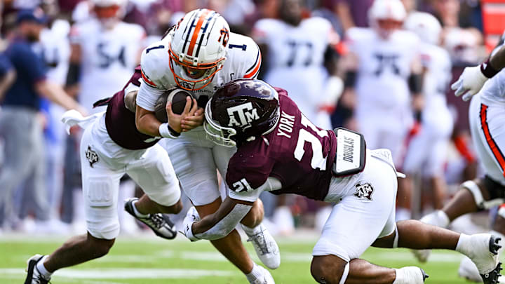 Auburn Tigers quarterback Payton Thorne (1) is tackled by Texas A&M Aggies defensive back Bryce Anderson (1) and linebacker Taurean York (21) during the first quarter at Kyle Field. Auburn Tigers quarterback Payton Thorne (1) is tackled by Texas A&M Aggies defensive back Bryce Anderson (1) and linebacker Taurean York (21) during the first quarter at Kyle Field.