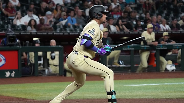 Sep 24, 2024; Phoenix, Arizona, USA; Arizona Diamondbacks second base Ketel Marte (4) hits against the San Francisco Giants in the ninth inning at Chase Field. Mandatory Credit: Rick Scuteri-Imagn Images