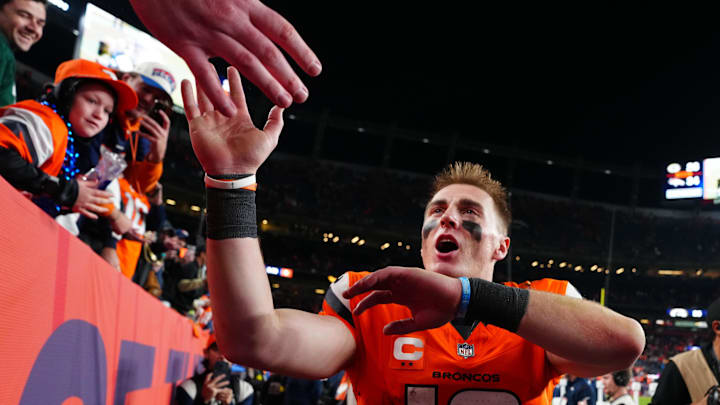 Dec 14, 2025; Denver, Colorado, USA; Denver Broncos quarterback Bo Nix (10) high-fives fans after defeating the Green Bay Packers at Empower Field at Mile High. Mandatory Credit: Ron Chenoy-Imagn Images Dec 14, 2025; Denver, Colorado, USA; Denver Broncos quarterback Bo Nix (10) high-fives fans after defeating the Green Bay Packers at Empower Field at Mile High. Mandatory Credit: Ron Chenoy-Imagn Images