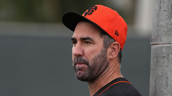Feb 13, 2025; Scottsdale, AZ, USA; San Francisco Giants pitcher Justin Verlander (35) watches players work out in the bullpen during spring training camp.