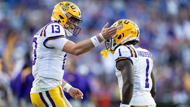 Nov 16, 2024; Gainesville, Florida, USA; LSU Tigers quarterback Garrett Nussmeier (13) celebrates with wide receiver Aaron Anderson (1) after a touchdown against the Florida Gators during the first half at Ben Hill Griffin Stadium. Mandatory Credit: Matt Pendleton-Imagn Images