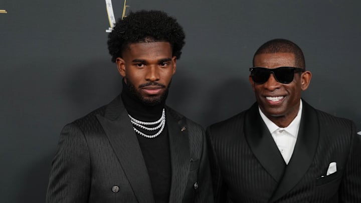 Feb 6, 2025; New Orleans, LA, USA;  Deion Sanders (right) with his son Shedeur Sanders on the red carpet before Super Bowl LIX NFL Honors at Saenger Theatre. Mandatory Credit: Kirby Lee-Imagn Images