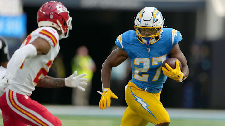 Sep 29, 2024; Inglewood, California, USA; Los Angeles Chargers running back J.K. Dobbins (27) carries the ball in the first quarter against the Kansas City Chiefs at SoFi Stadium. Sep 29, 2024; Inglewood, California, USA; Los Angeles Chargers running back J.K. Dobbins (27) carries the ball in the first quarter against the Kansas City Chiefs at SoFi Stadium.