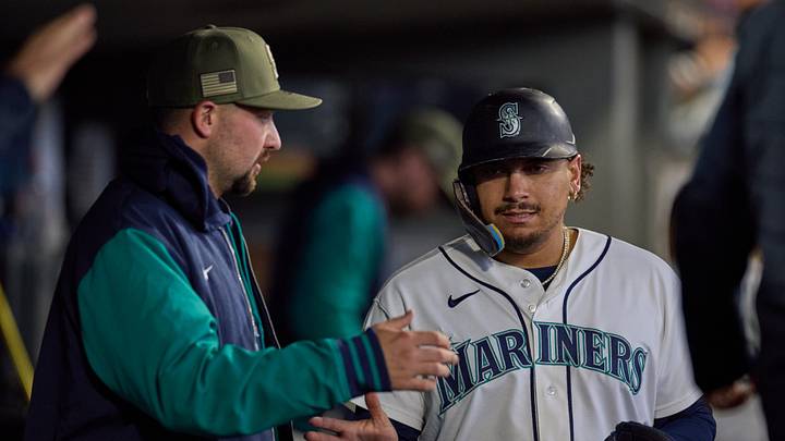 May 16, 2026; Seattle, Washington, USA; Seattle Mariners first baseman Josh Naylor (right) returns to the dugout after scoring and celebrates with teammate Cal Raleigh (left) in the fourth inning at T-Mobile Park. Mandatory Credit: Richard Dizon-Imagn Images
