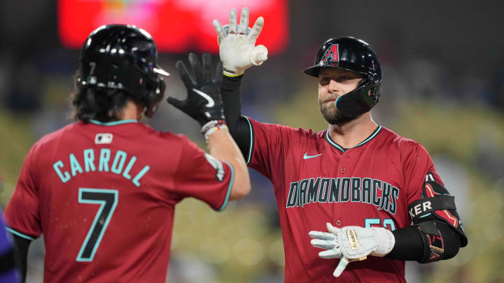 Jul 3, 2024; Los Angeles, California, USA; Arizona Diamondbacks first baseman Christian Walker (53) celebrates with center fielder Corbin Carroll (7) after hitting a three-run home run in the ninth inning against the Los Angeles Dodgers at Dodger Stadium. Jul 3, 2024; Los Angeles, California, USA; Arizona Diamondbacks first baseman Christian Walker (53) celebrates with center fielder Corbin Carroll (7) after hitting a three-run home run in the ninth inning against the Los Angeles Dodgers at Dodger Stadium.