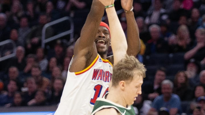 Mar 18, 2025; San Francisco, California, USA; Golden State Warriors forward Jimmy Butler III (10) is fouled by Milwaukee Bucks guard AJ Green (20) as he shoots a 3-point basket during the third quarter at Chase Center. Mandatory Credit: D. Ross Cameron-Imagn Images