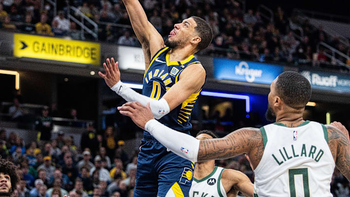 Jan 3, 2024; Indianapolis, Indiana, USA; Indiana Pacers guard Tyrese Haliburton (0) shoots the ball against Milwaukee. 