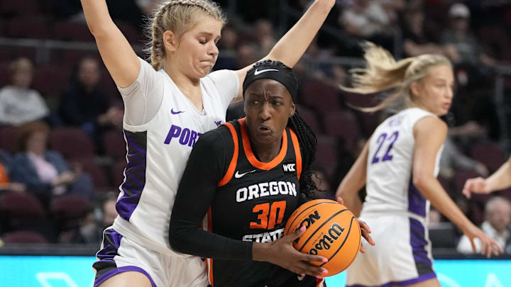 March 11, 2025; Las Vegas, NV, USA; Oregon State Beavers guard Catarina Ferreira (30) dribbles the basketball against Portland Pilots guard McKelle Meek (1) during the first half in the final of the West Coast Conference tournament at Orleans Arena. Mandatory Credit: Kyle Terada-Imagn Images