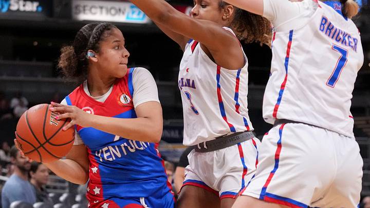 Kentucky All-Stars' A'Tylia Green (2) passes the ball over Indiana All-Stars' Kennedy Holman (3) and Joslyn Bricker (7) Saturday, June 6, 2026, during a game between the Indiana All-Stars and Kentucky All-Stars at Gainbridge Fieldhouse in Indianapolis. Kentucky All-Stars' A'Tylia Green (2) passes the ball over Indiana All-Stars' Kennedy Holman (3) and Joslyn Bricker (7) Saturday, June 6, 2026, during a game between the Indiana All-Stars and Kentucky All-Stars at Gainbridge Fieldhouse in Indianapolis.