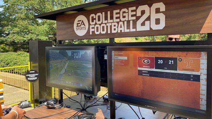 One of the stations where students and fans can play EA Sports College Football 26. The game is ready for players to pick up the controllers and start playing.