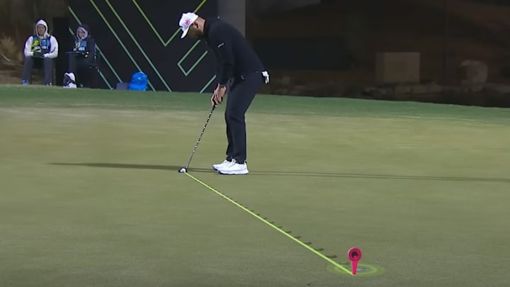 Jon Rahm lines up a putt at LIV Golf's Riyadh event.