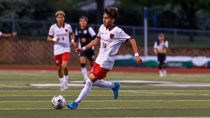 Gainesville midfielder Ethan Torres dribbles the ball against Bridgeport in a Class 4A Division II semifinal game. 