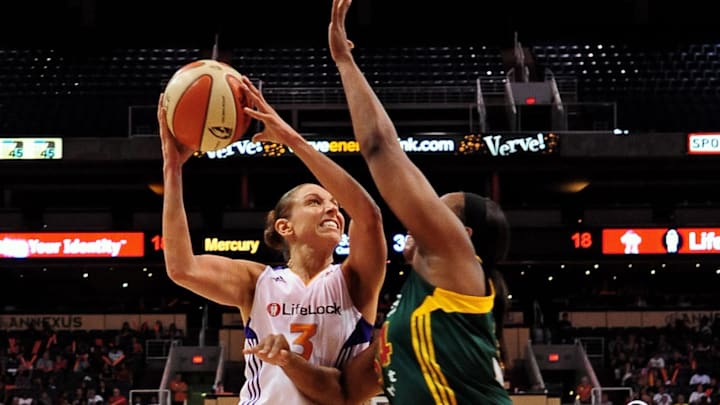 Sep 17 2011; Phoenix, AZ, USA; Phoenix Mercury guard Diana Taurasi (3) puts up a shot against Seattle Storm forward Le'coe Willingham (34) during the first half at the US Airways Center.  Mandatory Credit: Jennifer Stewart-Imagn Images