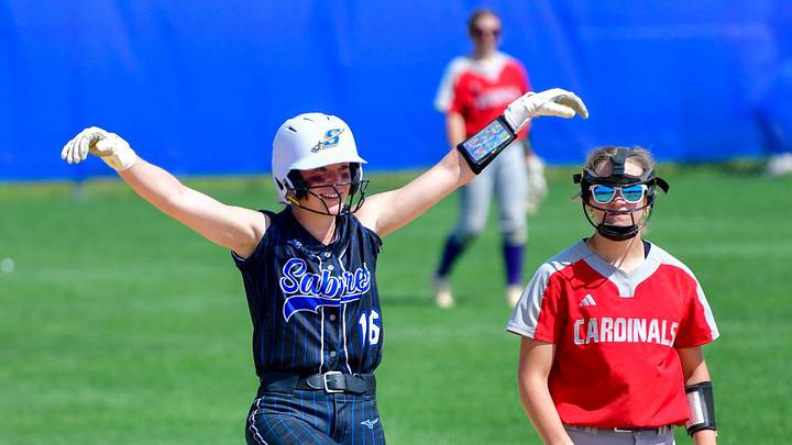 Sartell softball junior Marni Koosmann celebrates a double during the early game of a double header against Willmar and Moorhead on May 14, 2025 at Sartell High School. The Sabres beat the Cardinals 6-5 in eight innings, but lost to the Spuds 18-7.