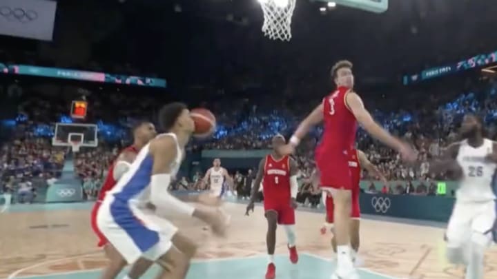 Victor Wembanyama gets hit in the face with a pass at the Paris Olympics.