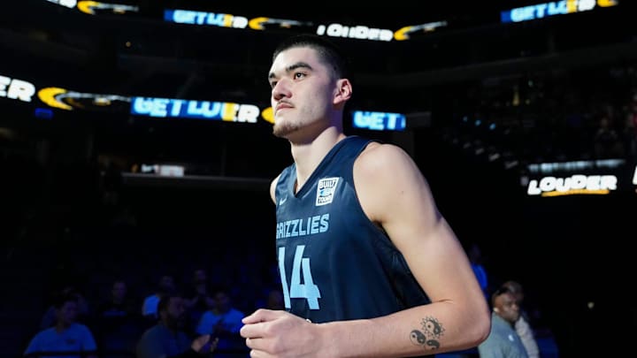 Memphis Grizzlies center Zach Edey (14) runs on the court as he is introduced during open practice at FedExForum. Memphis Grizzlies center Zach Edey (14) runs on the court as he is introduced during open practice at FedExForum.