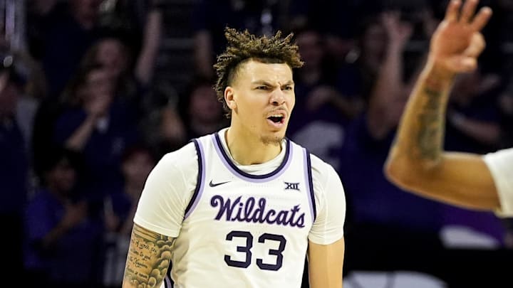Dec 30, 2024; Manhattan, Kansas, USA; Kansas State Wildcats guard Coleman Hawkins (33) and guard Dug McDaniel (0) celebrate during the first half against the Cincinnati Bearcats at Bramlage Coliseum. Mandatory Credit: Jay Biggerstaff-Imagn Images