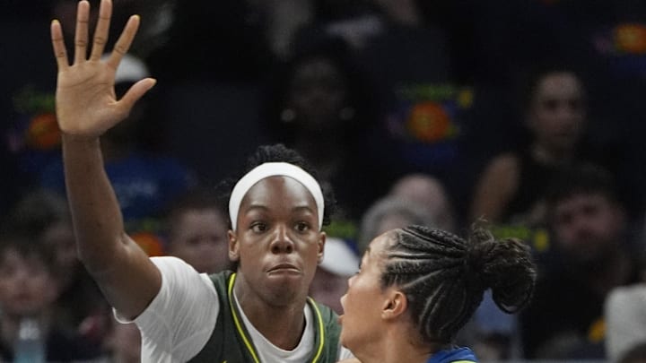 Aug 28, 2025; Minneapolis, Minnesota, USA; Minnesota Lynx forward Napheesa Collier (24) goes to the basket against Seattle Storm center Dominique Malonga (14) in the first quarter at Target Center. Mandatory Credit: Bruce Kluckhohn-Imagn Images