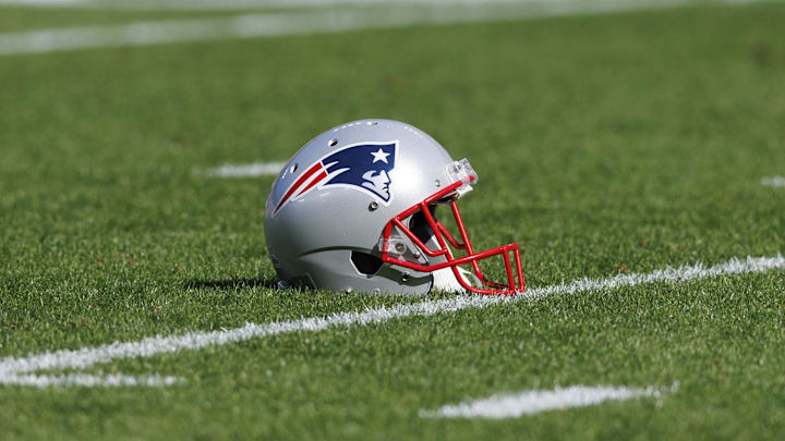 Oct 2, 2022; Green Bay, Wisconsin, USA; A New England Patriots helmet sits on the field during warmups prior to the game against the Green Bay Packers at Lambeau Field. Mandatory Credit: Jeff Hanisch-Imagn Images Oct 2, 2022; Green Bay, Wisconsin, USA; A New England Patriots helmet sits on the field during warmups prior to the game against the Green Bay Packers at Lambeau Field. Mandatory Credit: Jeff Hanisch-Imagn Images