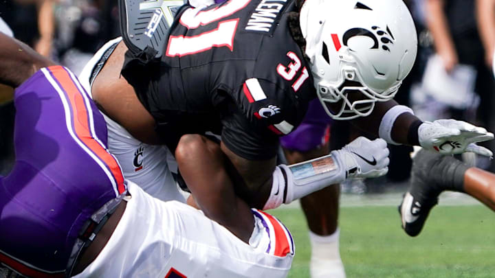 Northwestern State Demons defensive end Jeremiah Bodwin (7) tackles Cincinnati Bearcats linebacker Simeon Coleman (31) in the first quarter of a NCAA men’s college football game between the Cincinnati Bearcats and Northwestern State Demons, Saturday, Sept. 13, 2025, at Nippert Stadium in Cincinnati. Bearcats are up 56-0 by halftime.