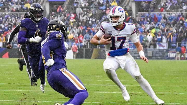 Oct 2, 2022; Baltimore, Maryland, USA;  Buffalo Bills quarterback Josh Allen (17) runs as Baltimore Ravens cornerback Marlon Humphrey (44) defends during the third quarter at M&T Bank Stadium. Mandatory Credit: Tommy Gilligan-Imagn Images