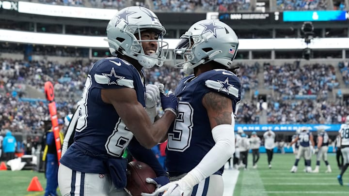 Dec 15, 2024; Charlotte, North Carolina, USA; Dallas Cowboys wide receiver Jalen Brooks (83) celebrates with running back Rico Dowdle (23) after catching a touchdown pass in the third quarter at Bank of America Stadium. Dec 15, 2024; Charlotte, North Carolina, USA; Dallas Cowboys wide receiver Jalen Brooks (83) celebrates with running back Rico Dowdle (23) after catching a touchdown pass in the third quarter at Bank of America Stadium.