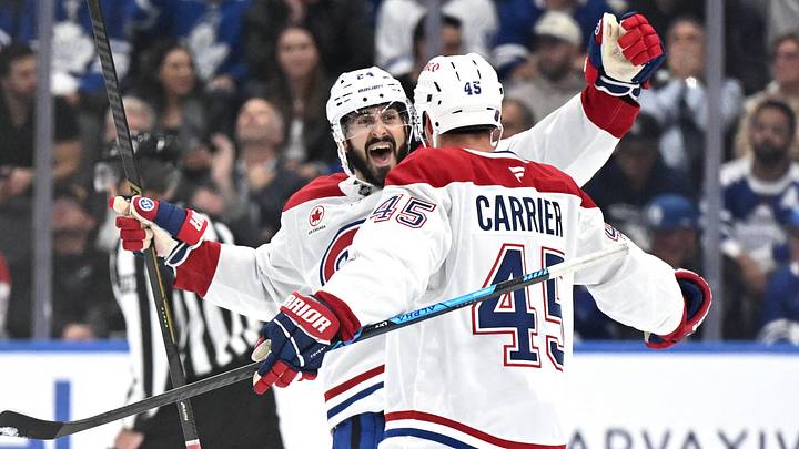 Sep 29, 2026; Toronto, Ontario, CAN;  Montreal Canadiens defenseman Alexandre Carrier (45) is greeted by forward Phillip Danault (24) after scoring a goal against the Toronto Maple Leafs in the third period at Scotiabank Arena.  Mandatory Credit: Dan Hamilton-Imagn Images