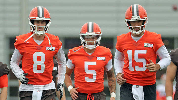 Cleveland Browns quarterbacks Kenny Pickett, left, Dillon Gabriel, center, and Joe Flacco warm up during an practice at the Browns training facility May 28, 2025, in Berea, Ohio. Cleveland Browns quarterbacks Kenny Pickett, left, Dillon Gabriel, center, and Joe Flacco warm up during an practice at the Browns training facility May 28, 2025, in Berea, Ohio.