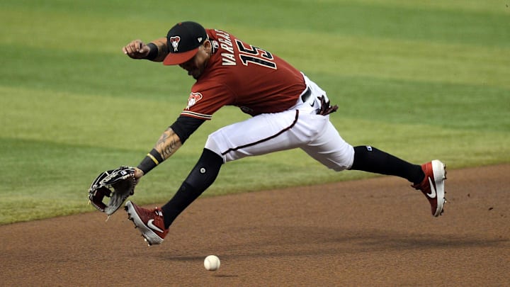Aug 2, 2020; Phoenix, Arizona, USA; Arizona Diamondbacks third baseman Ildemaro Vargas (15) attempts to run down a ground ball during the third inning at Chase Field. Mandatory Credit: Joe Camporeale-Imagn Images