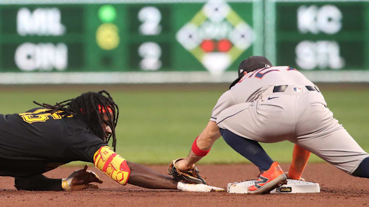 Jun 3, 2025; Pittsburgh, Pennsylvania, USA;  Houston Astros second baseman Jose Altuve (27) tags out center fielder Oneil Cruz (15) at second base during the eighth inning at PNC Park. Mandatory Credit: Charles LeClaire-Imagn Images