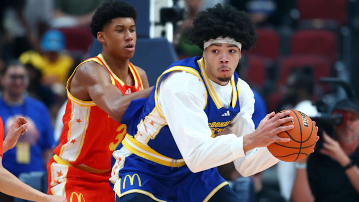 Mar 31, 2026; Glendale, AZ, USA; Tyran Stokes (4) controls the ball against Bruce Branch III (3) during the McDonalds All American Boys Game at Desert Diamond Arena. Mandatory Credit: Mark J. Rebilas-Imagn Images