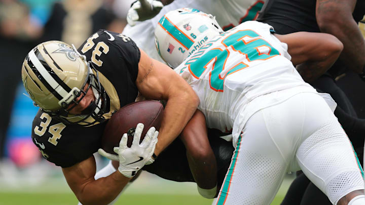 New Orleans Saints running back Evan Hull (34) is tackled by. Miami Dolphins cornerback Rasul Douglas (26) during the second half at Hard Rock Stadium. New Orleans Saints running back Evan Hull (34) is tackled by. Miami Dolphins cornerback Rasul Douglas (26) during the second half at Hard Rock Stadium.