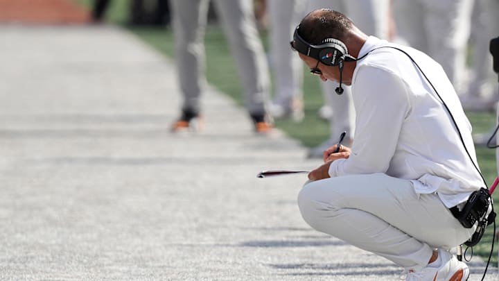 Sep 13, 2025; Austin, Texas, USA; Texas Longhorns head coach Steve Sarkisian takes notes during the first half against the Texas El Paso Miners at Darrell K Royal-Texas Memorial Stadium. Mandatory Credit: Scott Wachter-Imagn Images