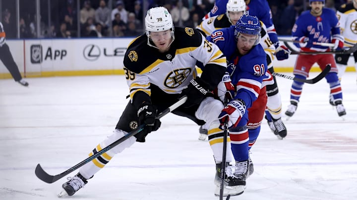 Feb 5, 2025; New York, New York, USA; Boston Bruins center Morgan Geekie (39) controls the puck against New York Rangers right wing Reilly Smith (91) during the first period at Madison Square Garden. Mandatory Credit: Brad Penner-Imagn Images Feb 5, 2025; New York, New York, USA; Boston Bruins center Morgan Geekie (39) controls the puck against New York Rangers right wing Reilly Smith (91) during the first period at Madison Square Garden. Mandatory Credit: Brad Penner-Imagn Images