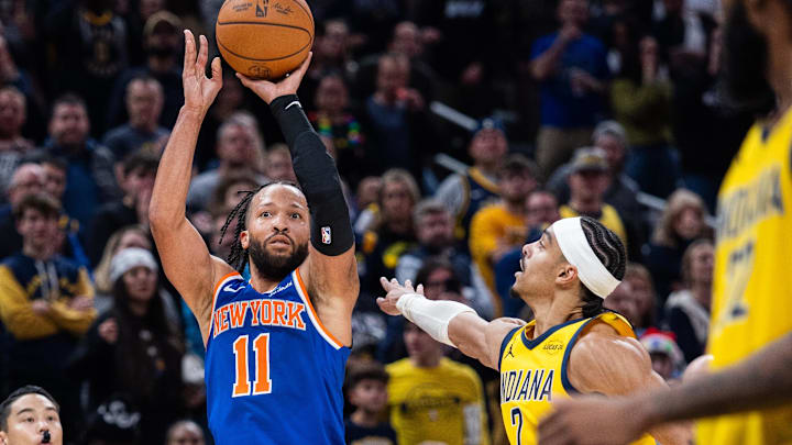 Dec 18, 2025; Indianapolis, Indiana, USA;  New York Knicks guard Jalen Brunson (11) shoots the winning shot  while Indiana Pacers guard/forward Andrew Nembhard (2) defends in the second half at Gainbridge Fieldhouse.